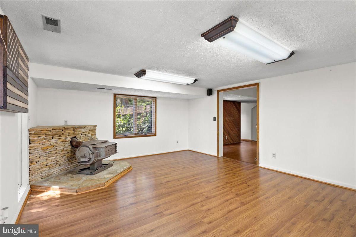 Empty room, Fireplace, Interior, Stone Walls, Wood Texture Flooring