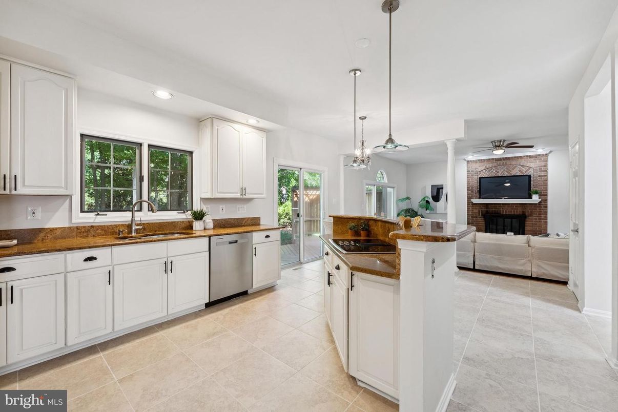 Fireplace, Interior, Kitchen, Living room, Pendant Lights, Recessed Lighting, Stainless Steel Appliances, Stone Walls