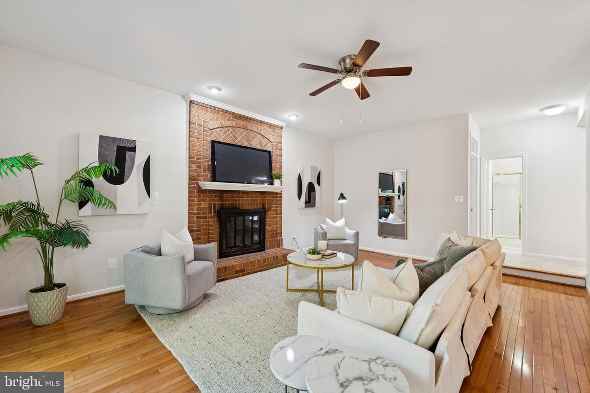 Fireplace, Interior, Living room, Recessed Lighting, Stone Walls, Wood Texture Flooring