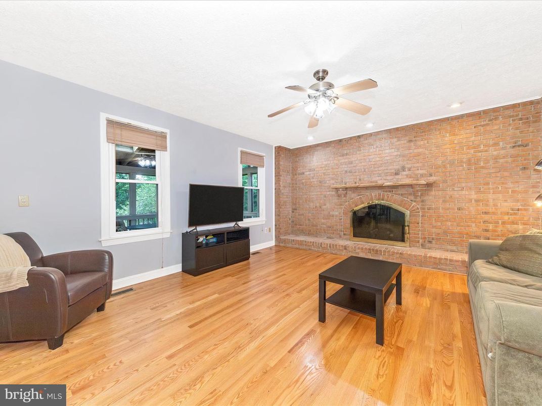 Fireplace, Interior, Living room, Recessed Lighting, Stone Walls, Wood Texture Flooring