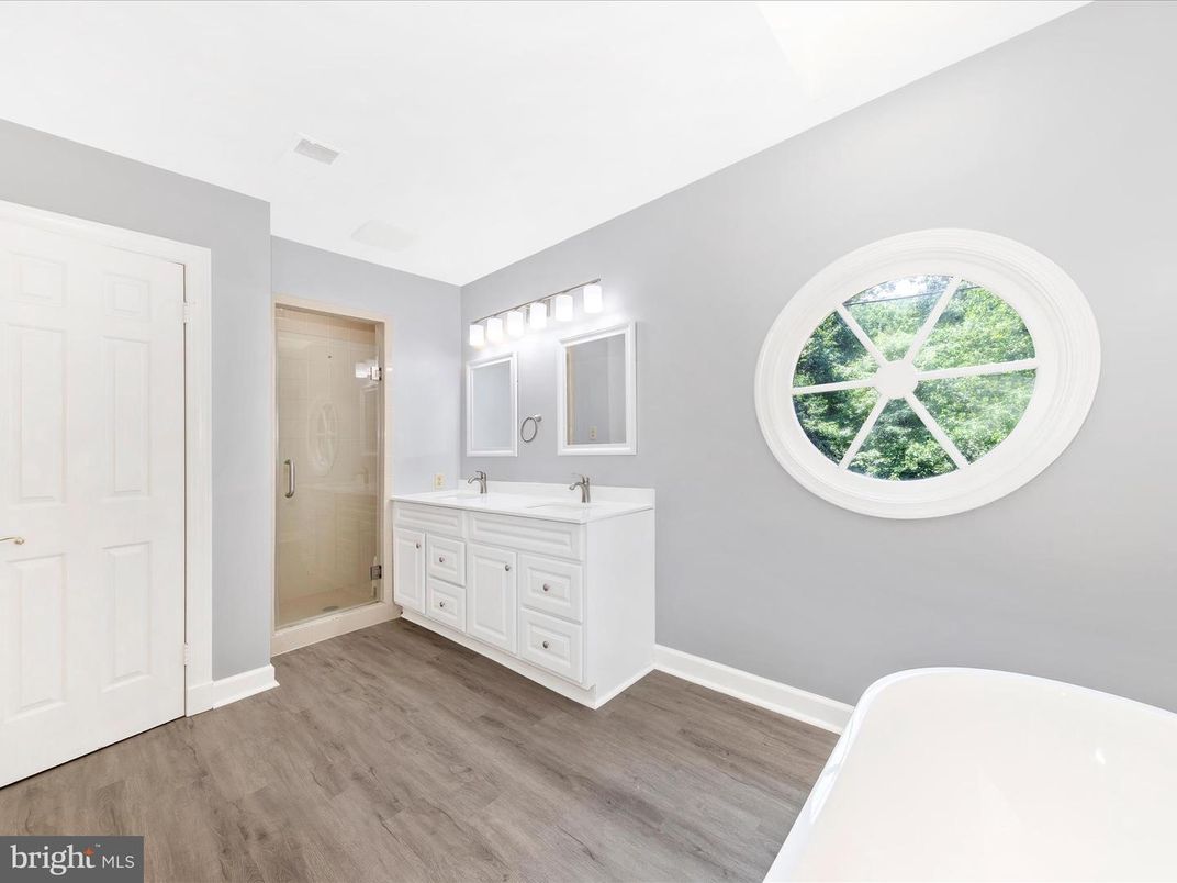 Bathroom, Dual Sink Vanities, Glass Shower, Interior, Wood Texture Flooring