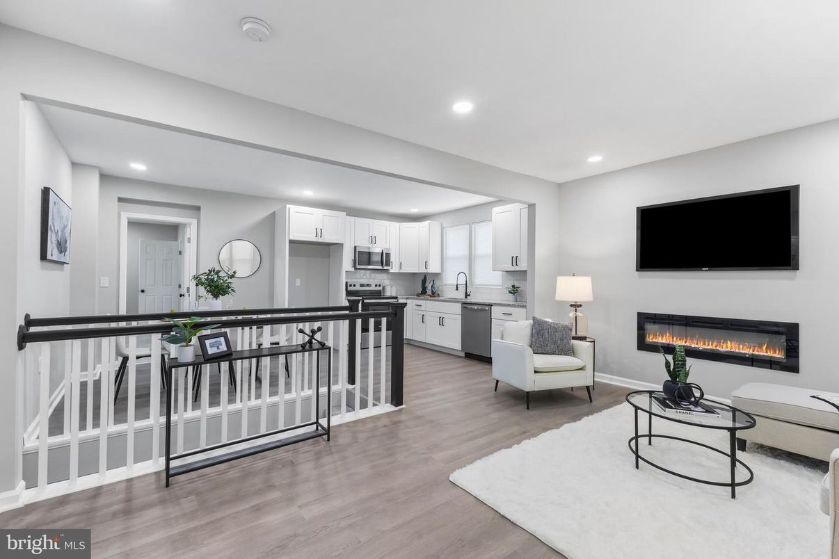 Fireplace, Interior, Kitchen, Living room, Recessed Lighting, Stainless Steel Appliances, Wood Texture Flooring