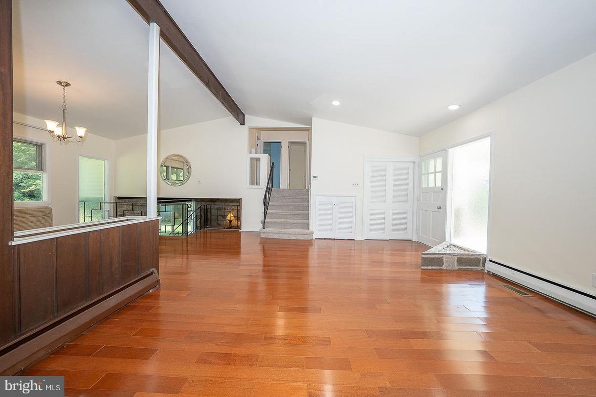 Chandelier, Empty room, Fireplace, Interior, Recessed Lighting, Wooden Beams, Wood Texture Flooring