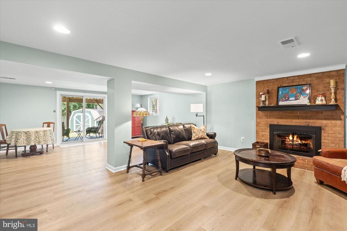 Fireplace, Interior, Living room, Recessed Lighting, Stone Walls, Wood Texture Flooring