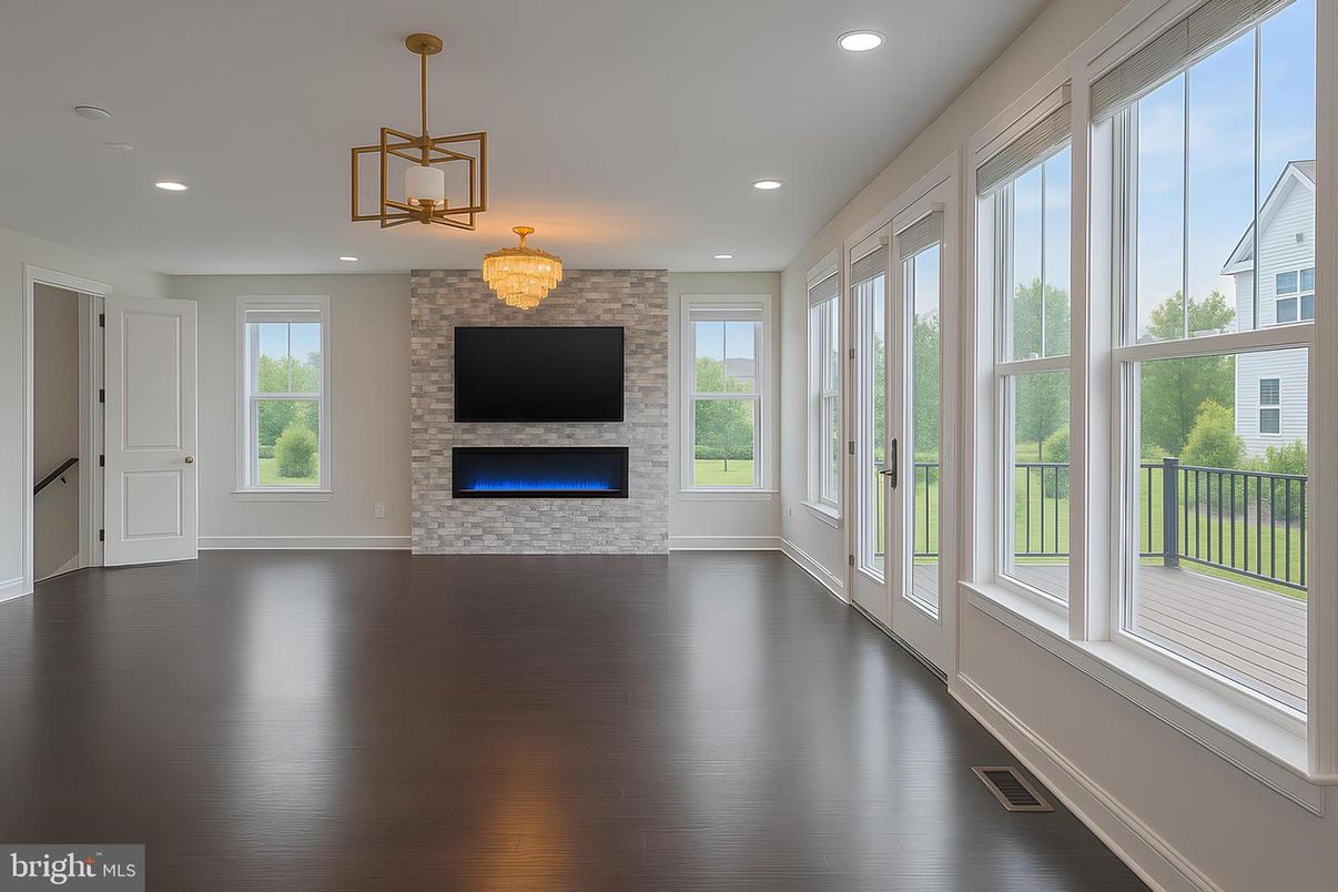 Chandelier, Empty room, Fireplace, Interior, Recessed Lighting, Stone Walls, Wood Texture Flooring