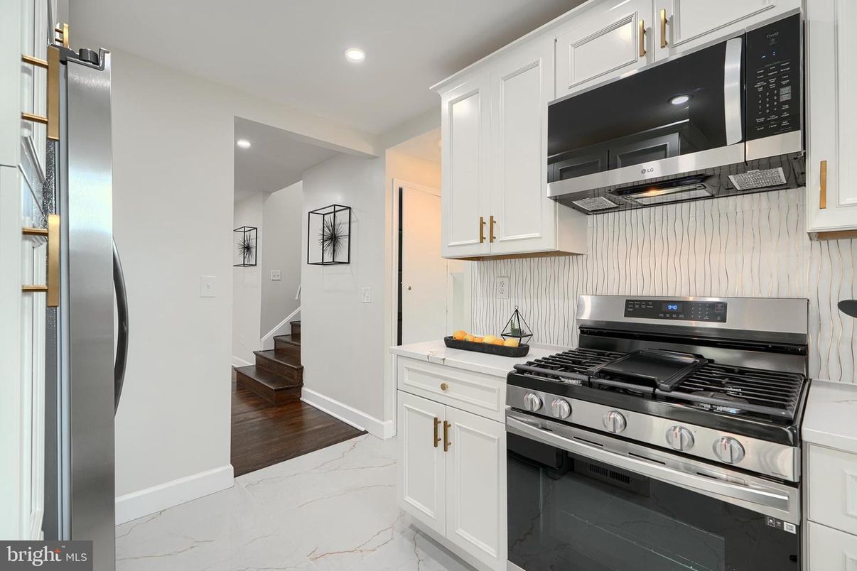 Interior, Kitchen, Marble, Recessed Lighting, Stainless Steel Appliances, Wood Texture Flooring