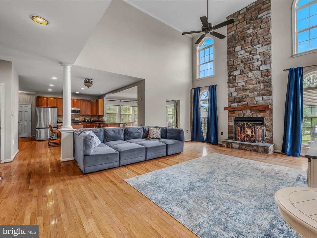 Fireplace, Interior, Kitchen, Living room, Recessed Lighting, Stone Walls, Wood Texture Flooring
