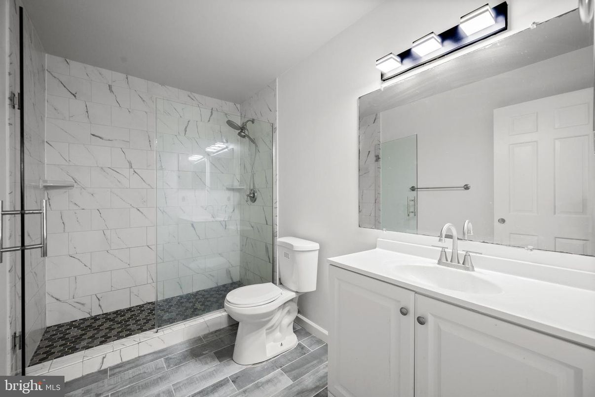 Bathroom, Glass Shower, Interior, Marble Walls, Wood Texture Flooring
