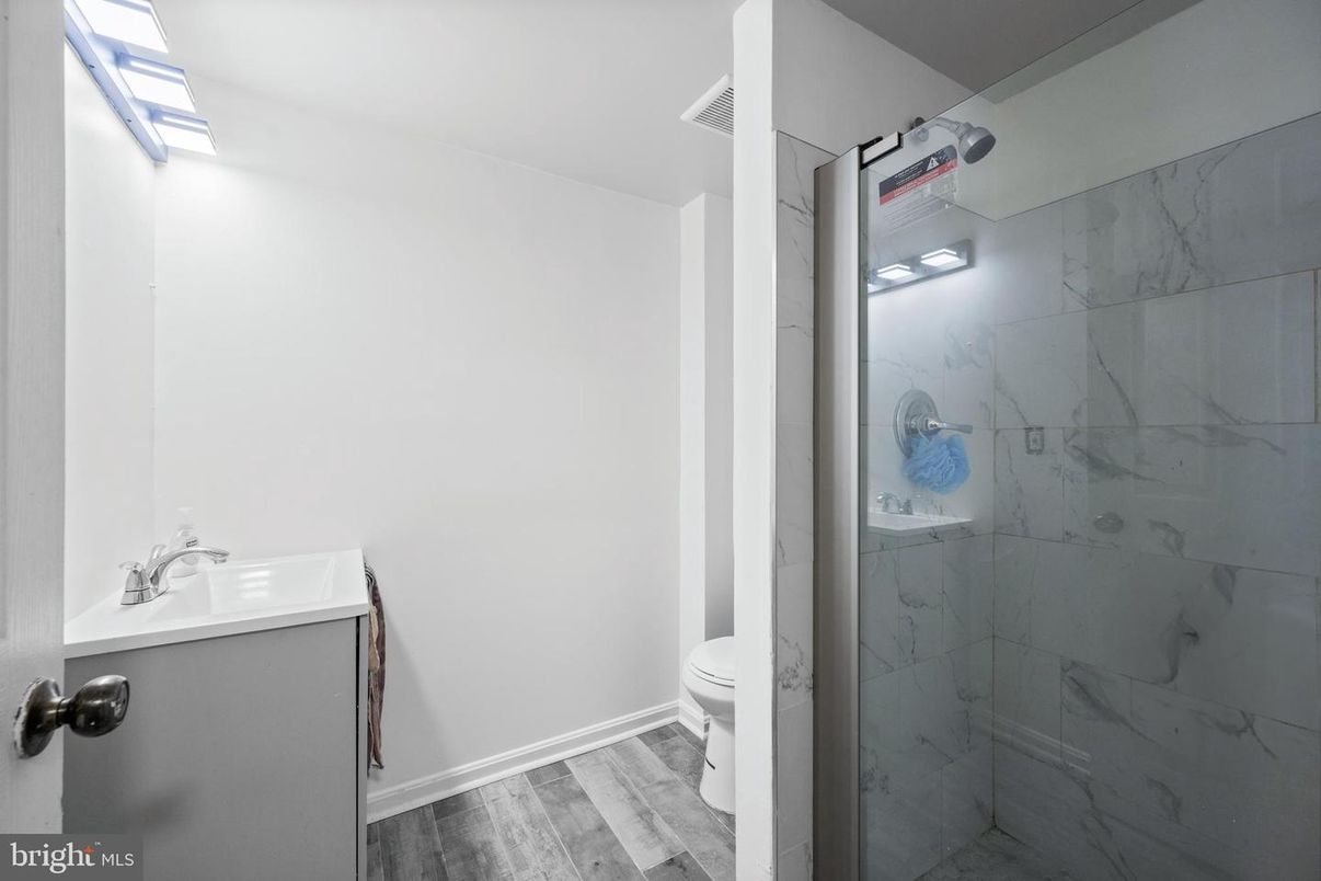 Bathroom, Glass Shower, Interior, Marble Walls, Wood Texture Flooring