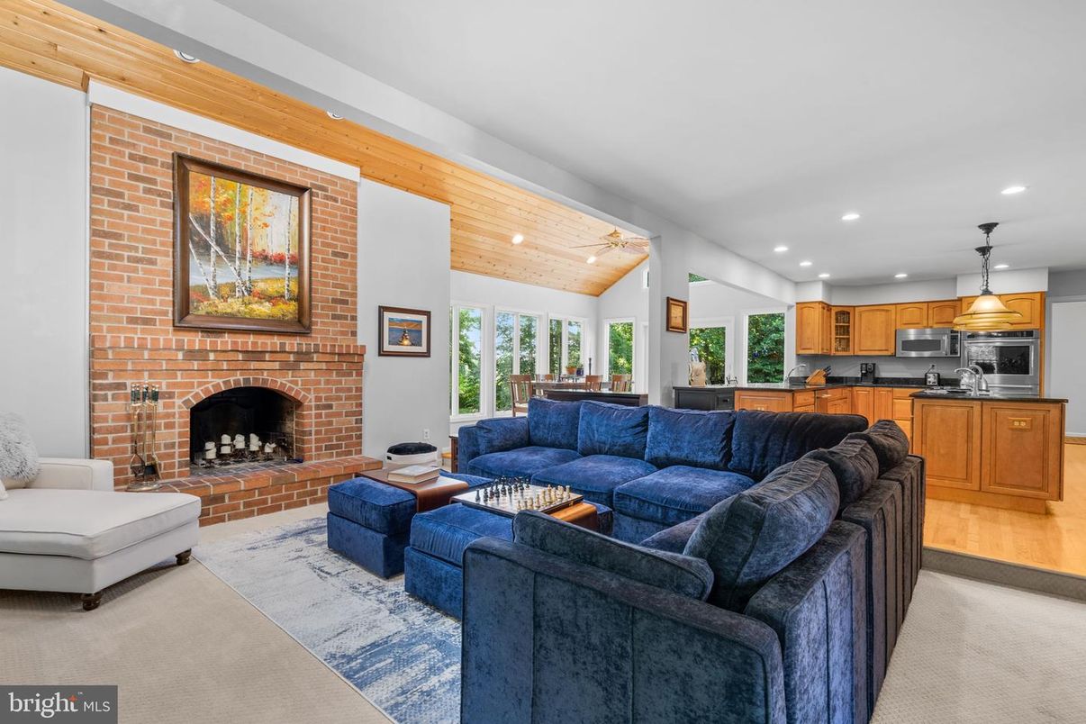 Fireplace, Interior, Kitchen, Living room, Pendant Lights, Recessed Lighting, Stainless Steel Appliances, Stone Walls, Wooden Ceilings