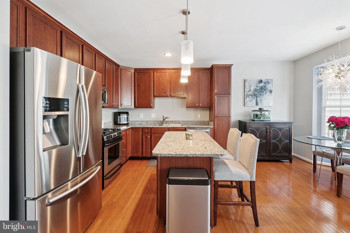 Dining room, Interior, Kitchen, Pendant Lights, Recessed Lighting, Stainless Steel Appliances, Wood Texture Flooring