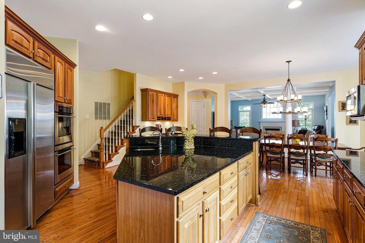 Chandelier, Dining room, Interior, Kitchen, Pendant Lights, Recessed Lighting, Stainless Steel Appliances, Wood Texture Flooring