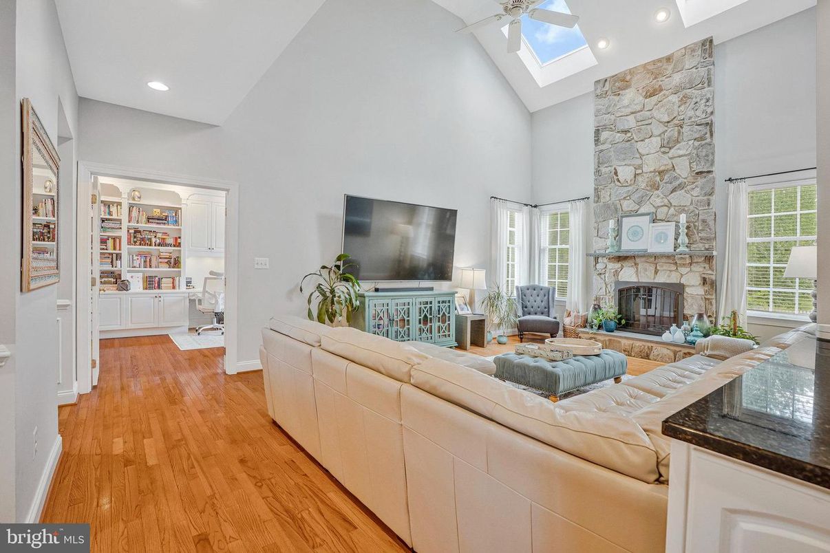 Fireplace, Interior, Living room, Recessed Lighting, Stone Walls, Wood Texture Flooring