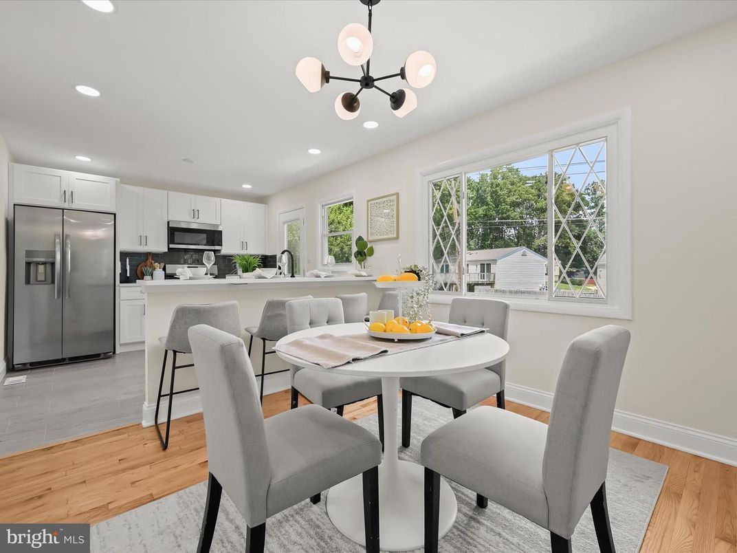 Dining room, Interior, Kitchen, Pendant Lights, Recessed Lighting, Stainless Steel Appliances, Wood Texture Flooring