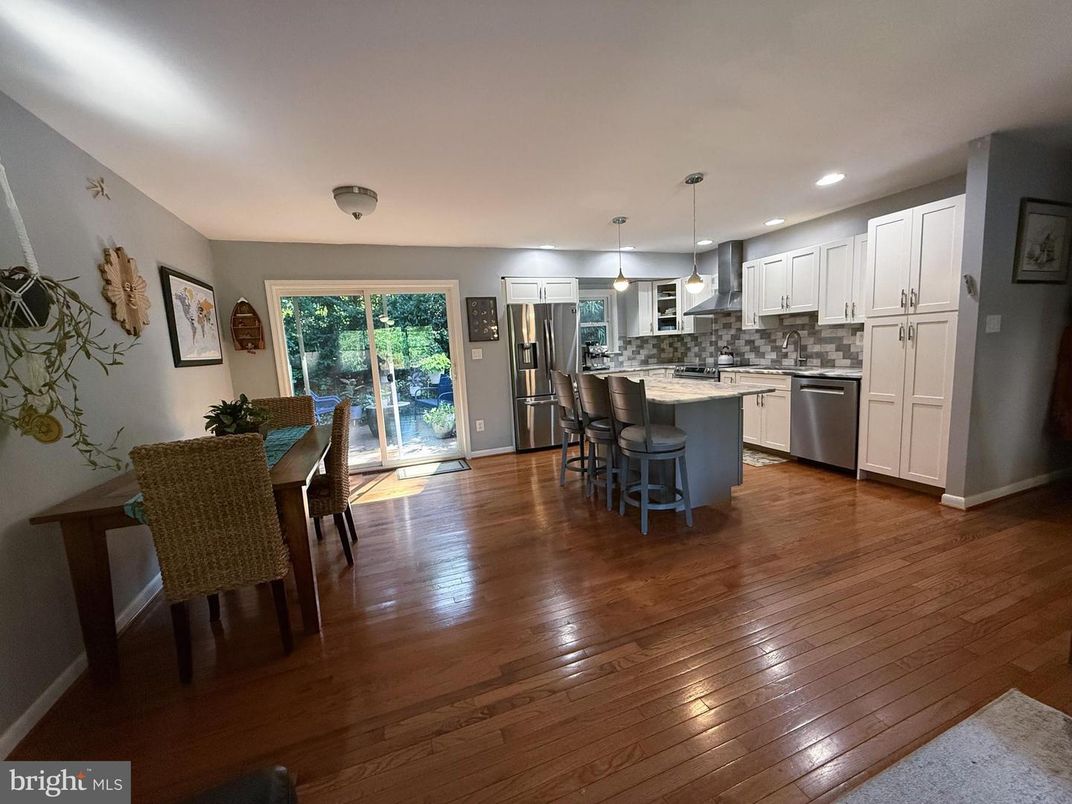 Dining room, Interior, Kitchen, Pendant Lights, Recessed Lighting, Stainless Steel Appliances, Wood Texture Flooring