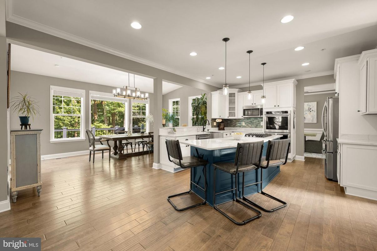 Chandelier, Dining room, Interior, Kitchen, Pendant Lights, Recessed Lighting, Stainless Steel Appliances, Wood Texture Flooring