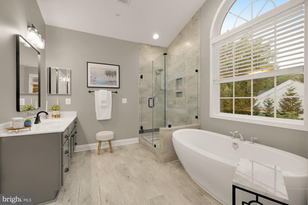 Bathroom, Dual Sink Vanities, Free Standing Baths, Glass Shower, Interior, Recessed Lighting, Wood Texture Flooring
