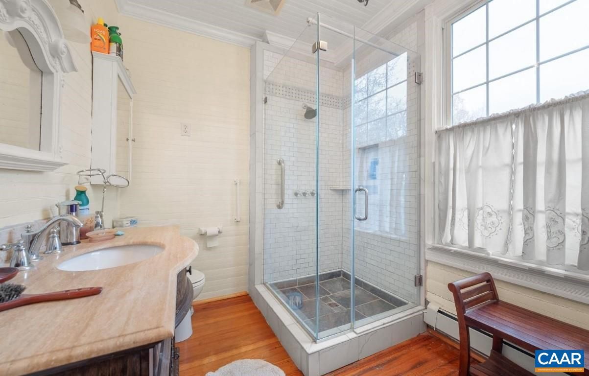 Bathroom, Dual Sink Vanities, Glass Shower, Interior, Wood Texture Flooring