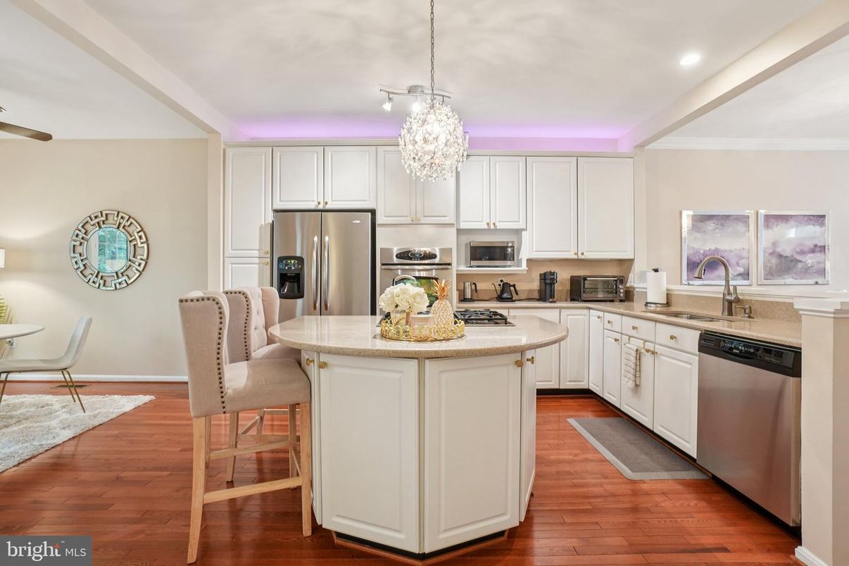 Chandelier, Dining room, Interior, Kitchen, Pendant Lights, Recessed Lighting, Stainless Steel Appliances, Wood Texture Flooring