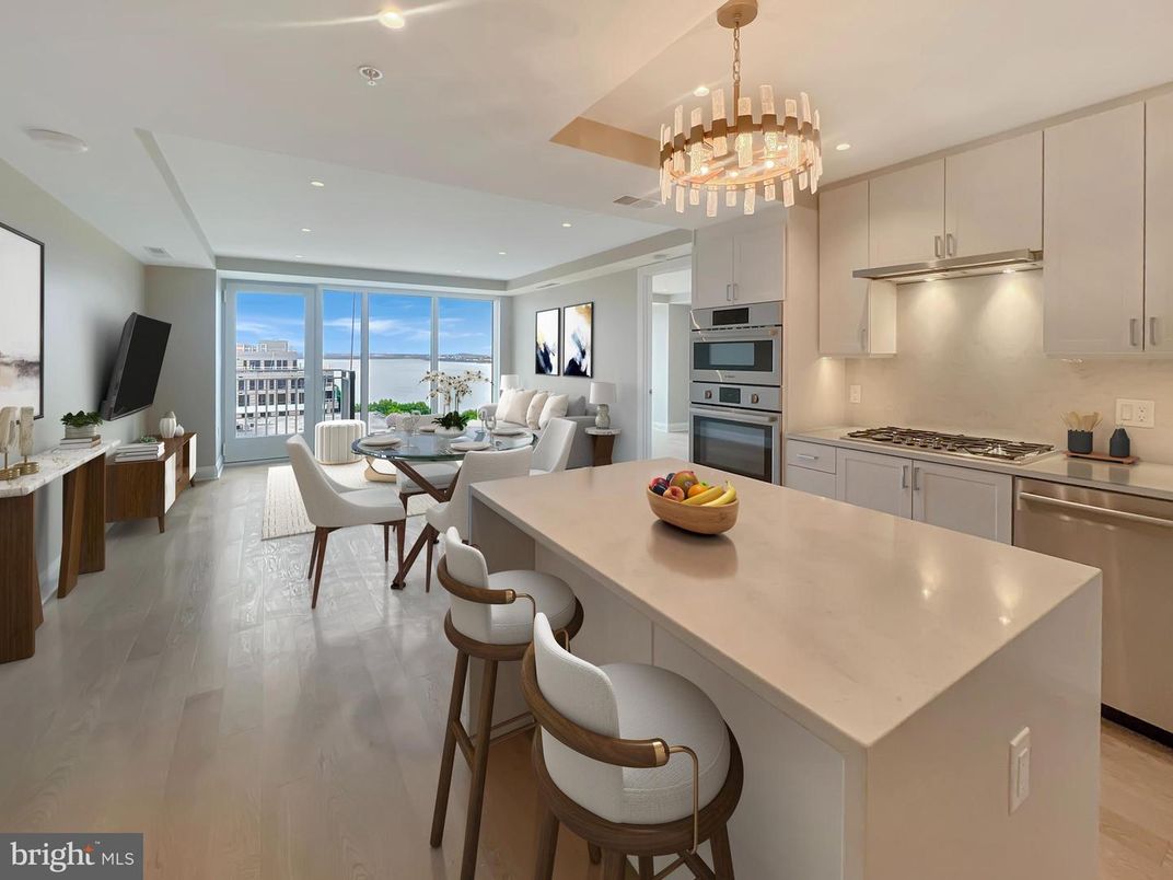 Chandelier, Dining room, Interior, Kitchen, Living room, Pendant Lights, Recessed Lighting, Stainless Steel Appliances, Water, Wood Texture Flooring