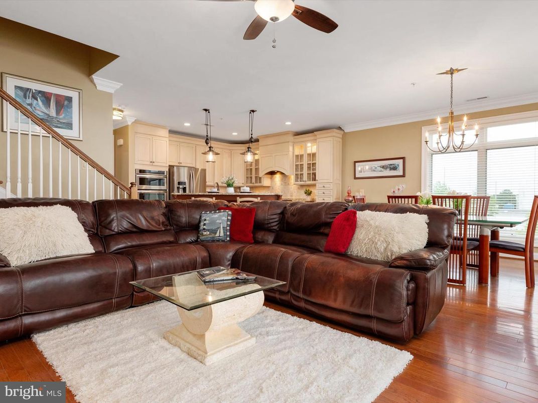 Chandelier, Dining room, Interior, Kitchen, Living room, Pendant Lights, Recessed Lighting, Stainless Steel Appliances, Wood Texture Flooring