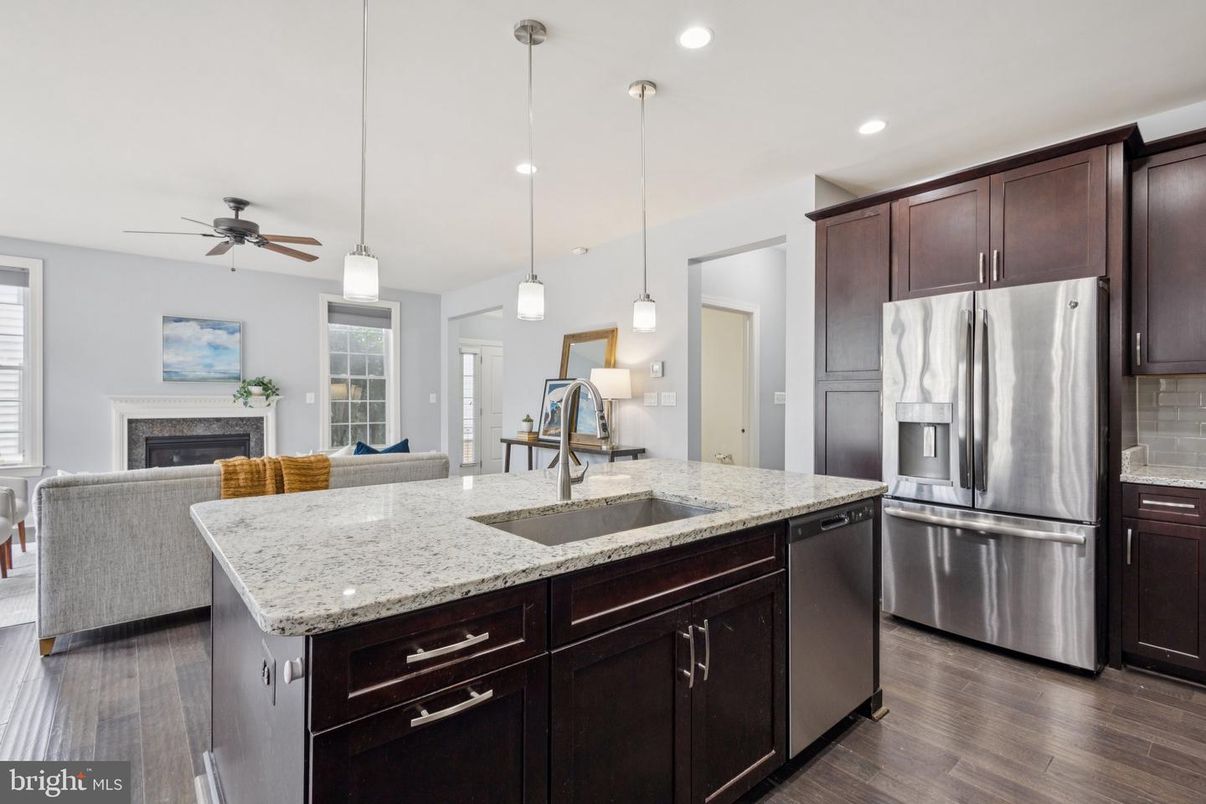 Fireplace, Interior, Kitchen, Living room, Pendant Lights, Recessed Lighting, Stainless Steel Appliances, Wood Texture Flooring
