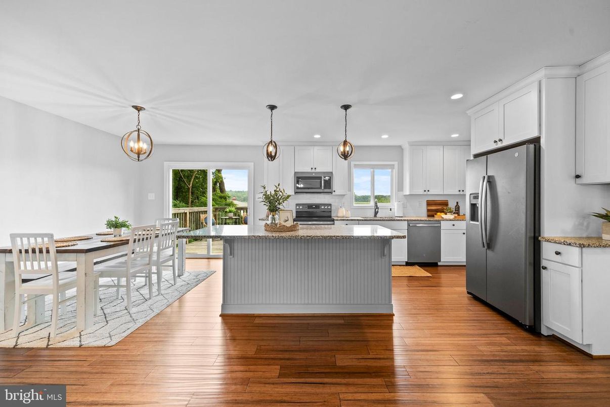 Dining room, Interior, Kitchen, Pendant Lights, Recessed Lighting, Stainless Steel Appliances, Wood Texture Flooring