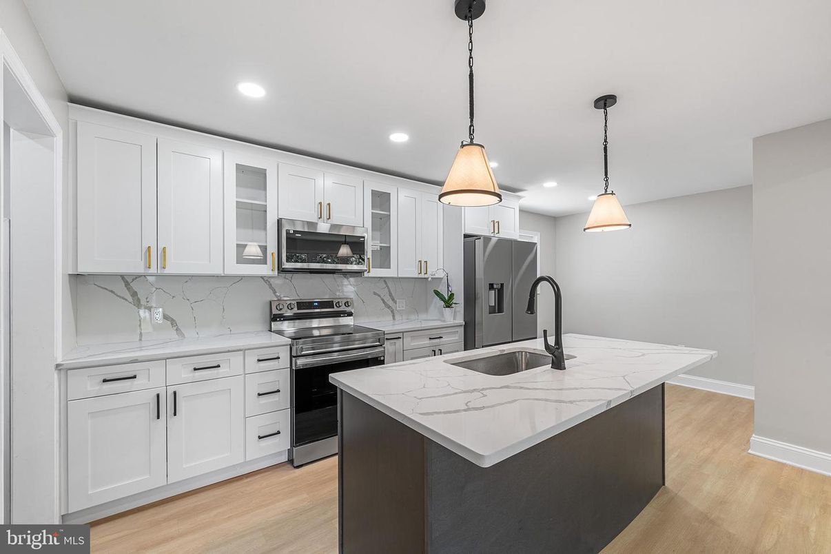 Interior, Kitchen, Marble Walls, Pendant Lights, Recessed Lighting, Stainless Steel Appliances, Wood Texture Flooring