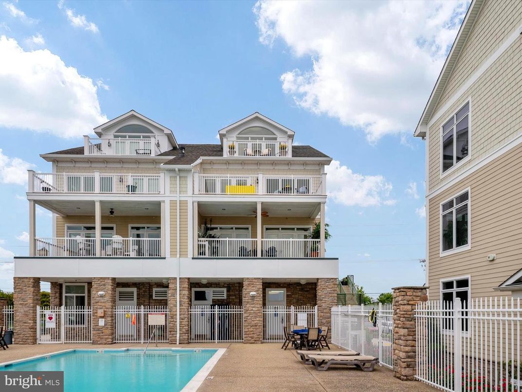 Exterior, Facade, Brick Facade, Pool, Condo Building