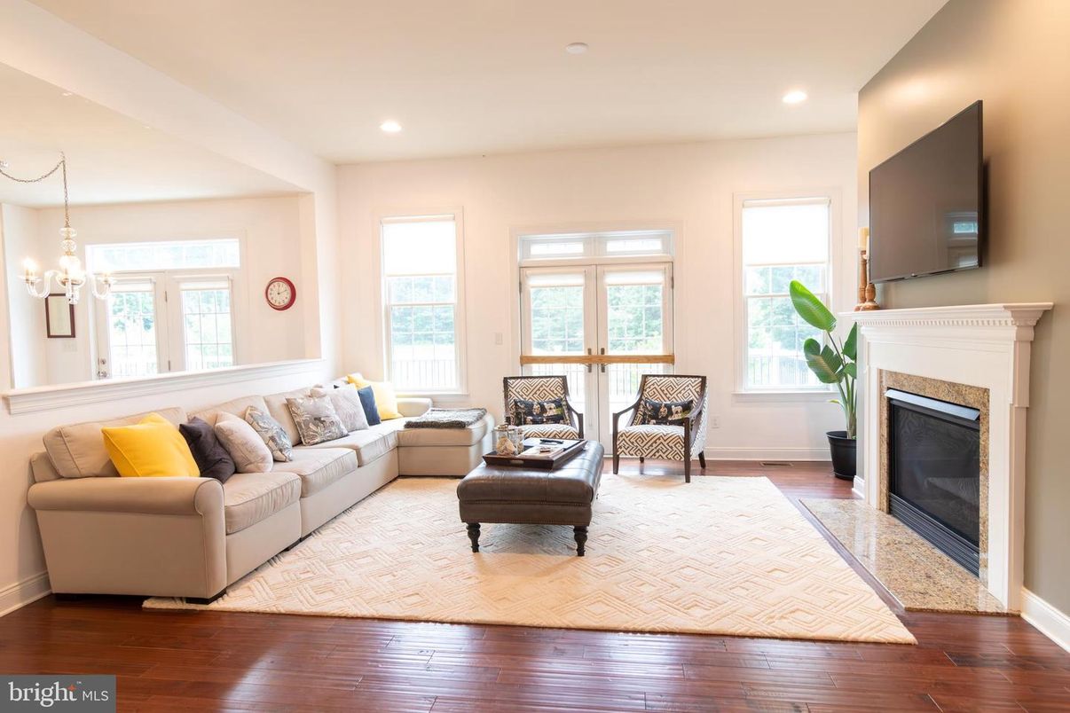 Chandelier, Fireplace, Interior, Living room, Recessed Lighting, Wood Texture Flooring