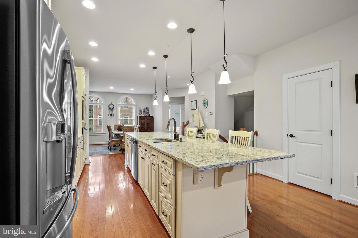 Dining room, Interior, Kitchen, Pendant Lights, Recessed Lighting, Stainless Steel Appliances, Wood Texture Flooring