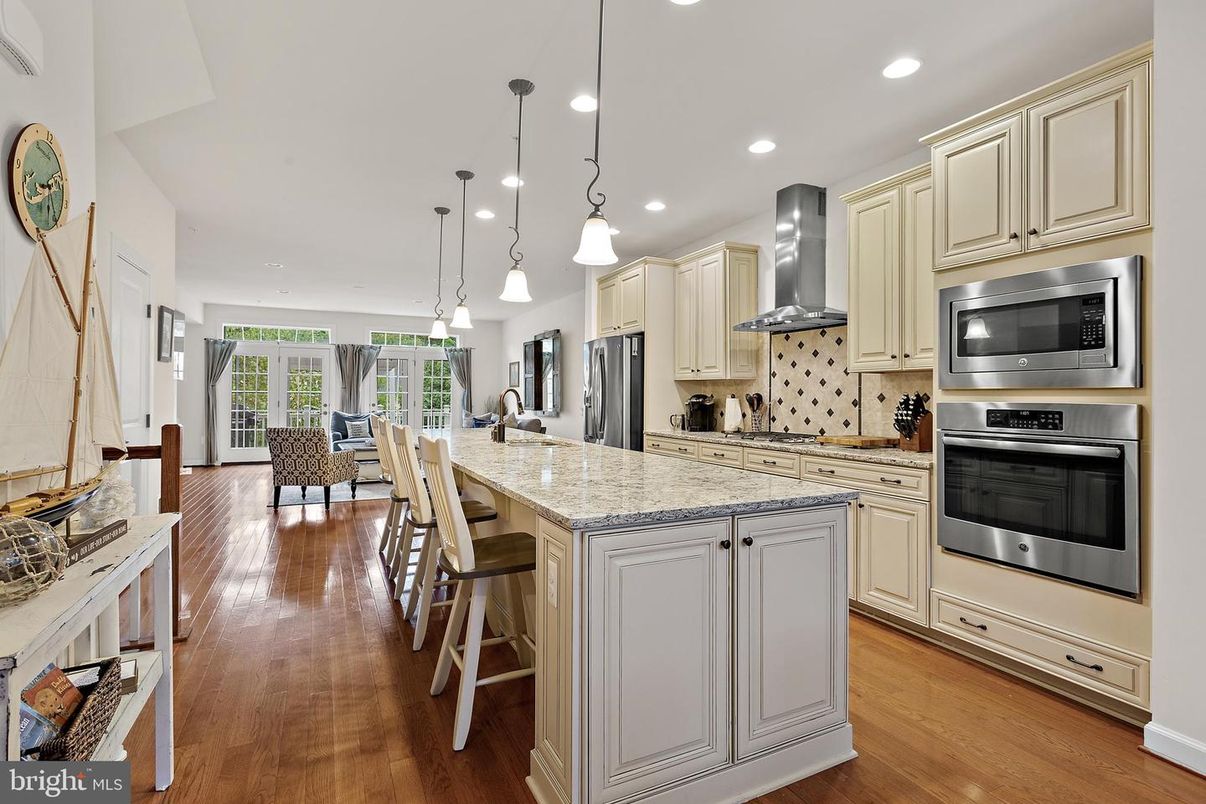 Dining room, Interior, Kitchen, Pendant Lights, Recessed Lighting, Stainless Steel Appliances, Wood Texture Flooring