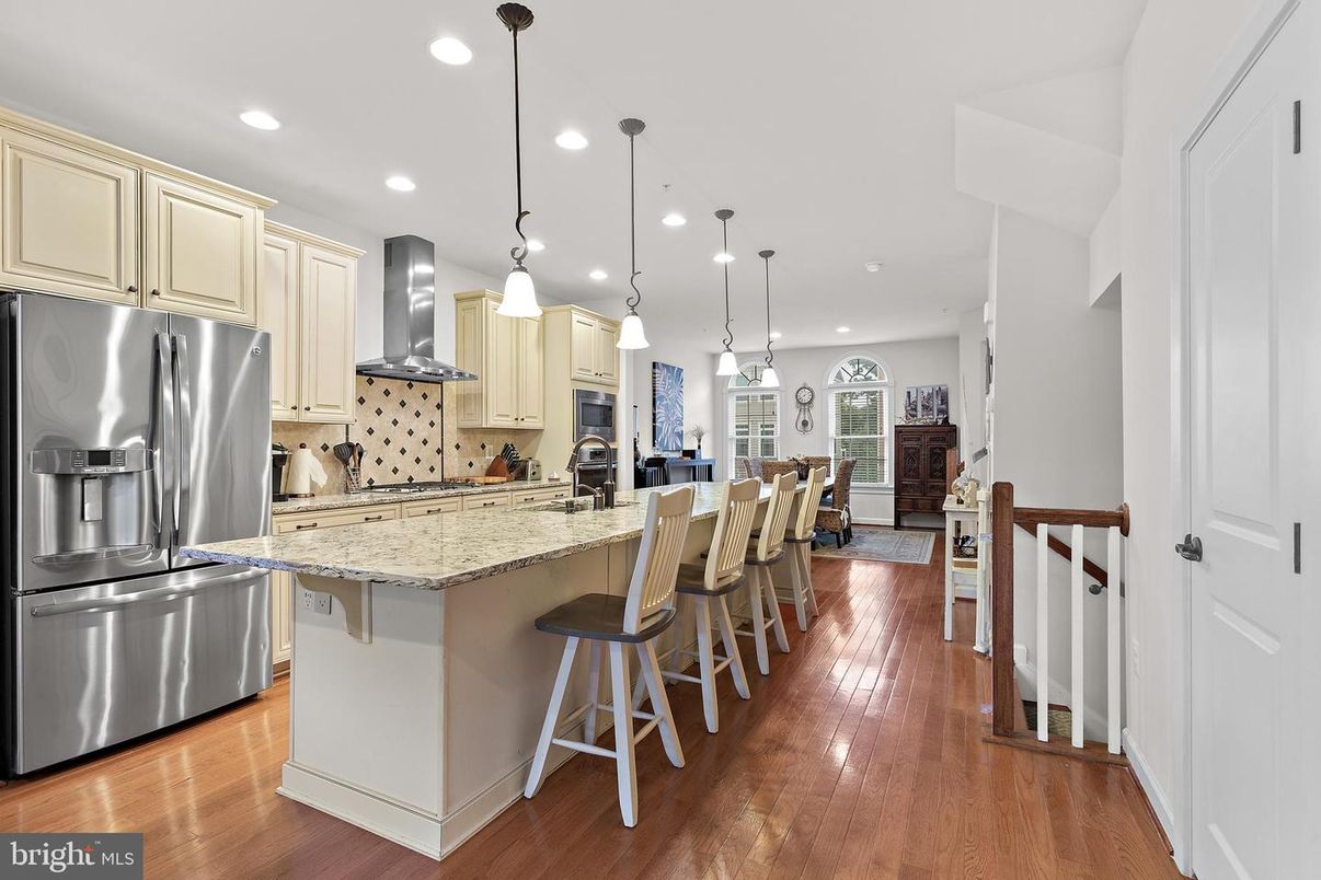 Dining room, Interior, Kitchen, Pendant Lights, Recessed Lighting, Stainless Steel Appliances, Wood Texture Flooring