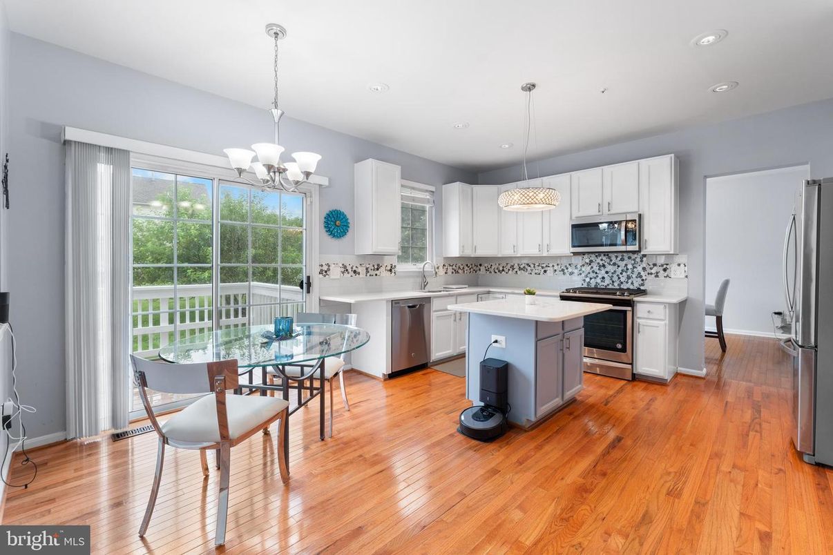Chandelier, Dining room, Interior, Kitchen, Pendant Lights, Recessed Lighting, Stainless Steel Appliances, Wood Texture Flooring