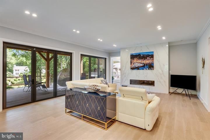 Fireplace, Interior, Living room, Marble Walls, Recessed Lighting, Wood Texture Flooring