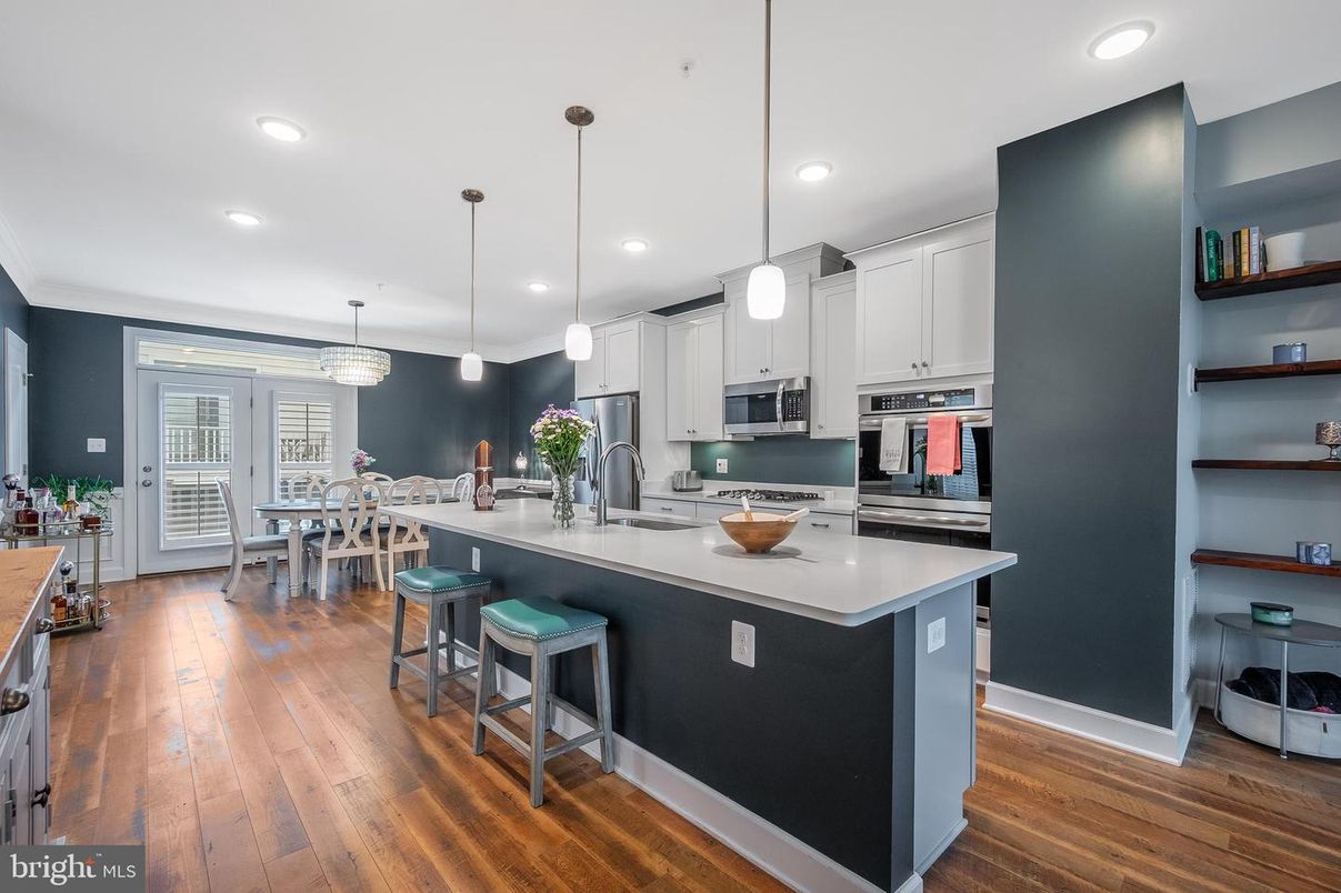 Dining room, Interior, Kitchen, Pendant Lights, Recessed Lighting, Stainless Steel Appliances, Wood Texture Flooring