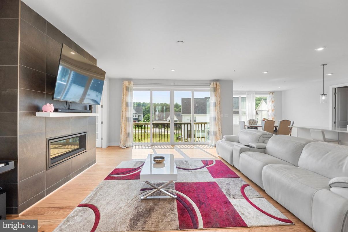 Dining room, Fireplace, Interior, Living room, Pendant Lights, Recessed Lighting, Wood Texture Flooring