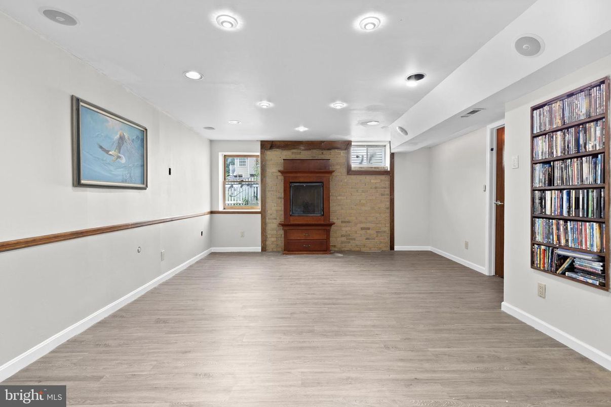 Empty room, Fireplace, Interior, Recessed Lighting, Stone Walls, Wood Texture Flooring
