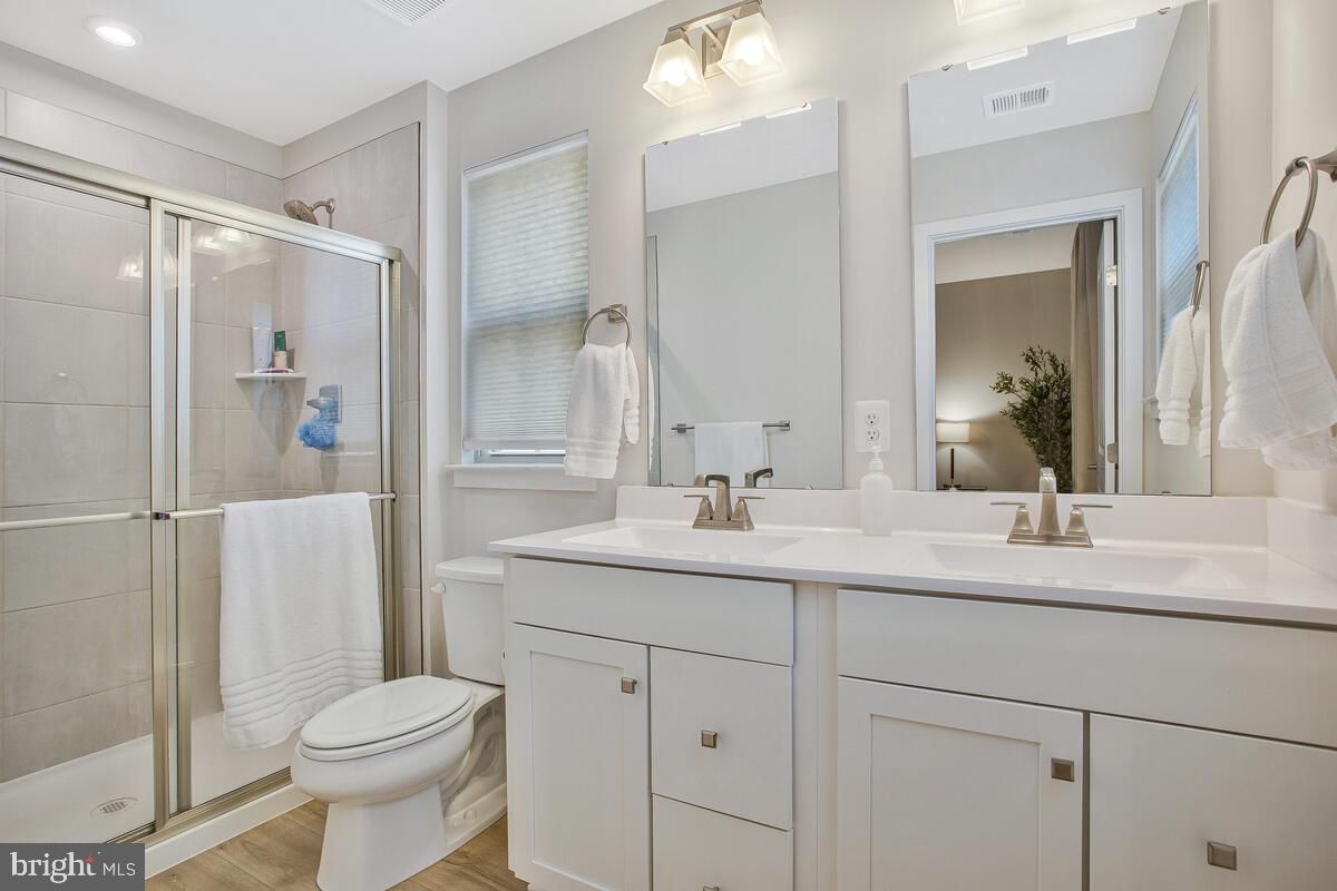 Bathroom, Dual Sink Vanities, Glass Shower, Interior, Recessed Lighting, Wood Texture Flooring