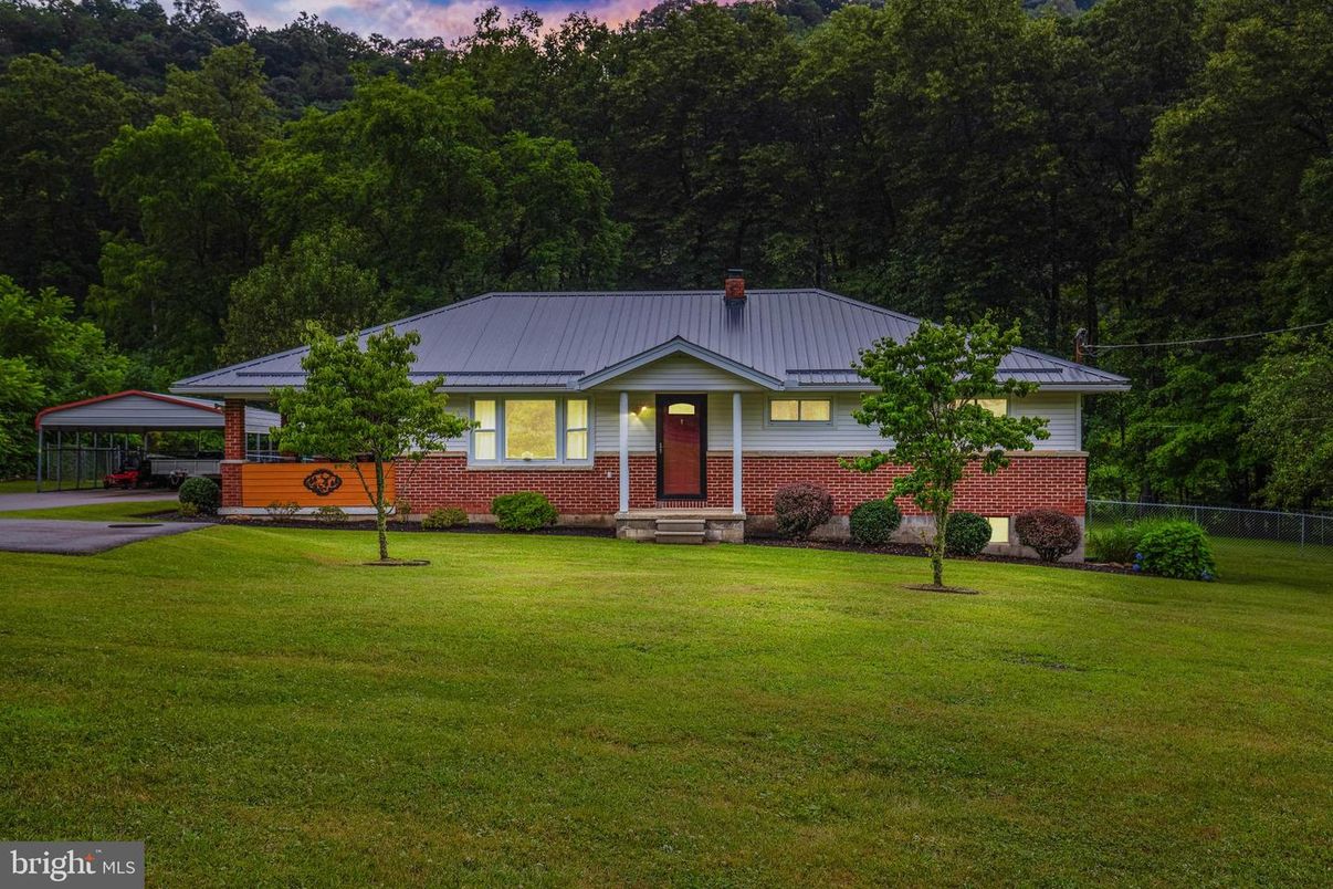 Attached, Backyard, Exterior, Facade, Brick Facade, Solar Panels, None