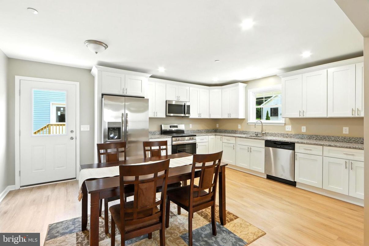 Dining room, Interior, Kitchen, Recessed Lighting, Stainless Steel Appliances, Wood Texture Flooring