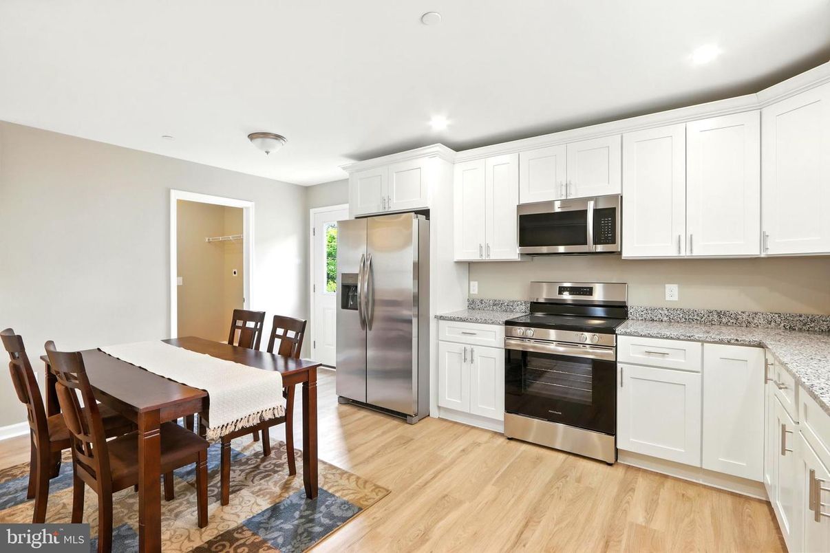 Dining room, Interior, Kitchen, Recessed Lighting, Stainless Steel Appliances, Wood Texture Flooring