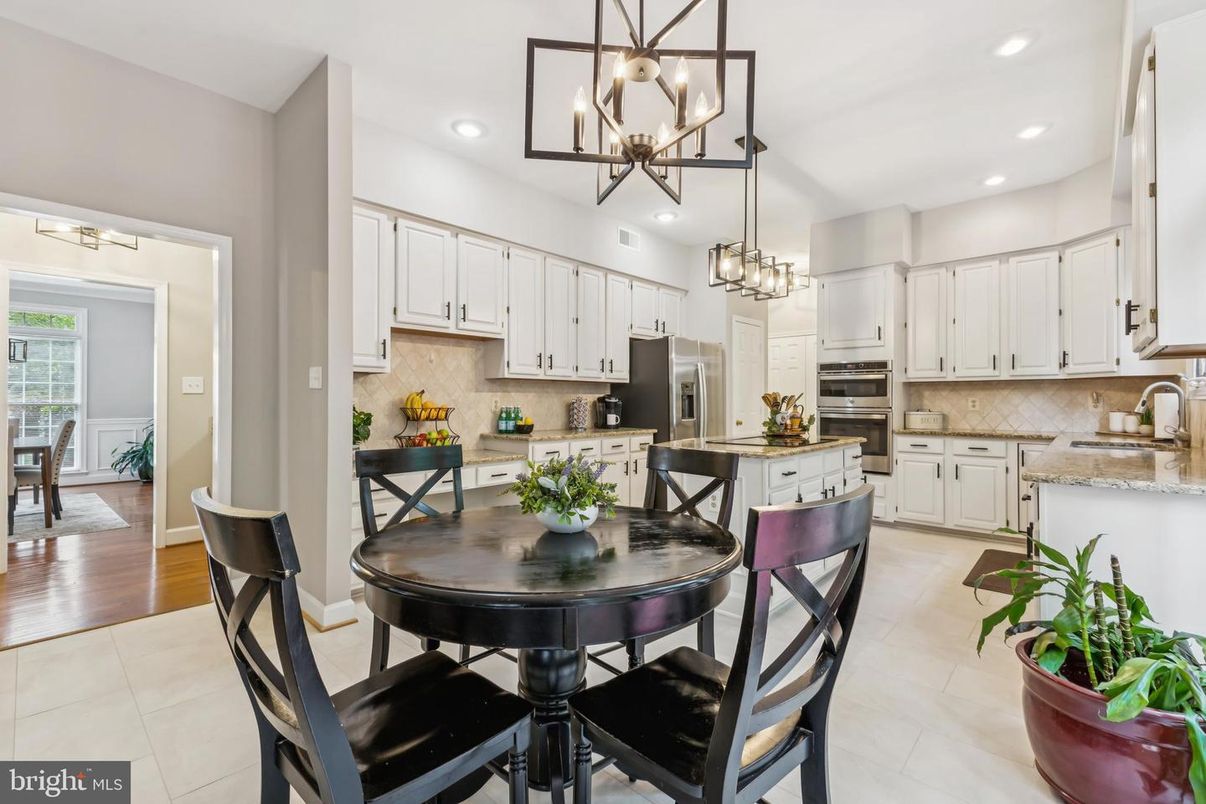 Chandelier, Dining room, Interior, Kitchen, Pendant Lights, Recessed Lighting, Stainless Steel Appliances, Wood Texture Flooring