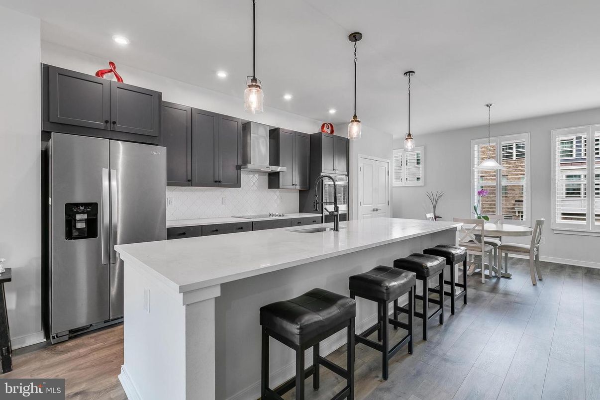 Dining room, Interior, Kitchen, Pendant Lights, Recessed Lighting, Stainless Steel Appliances, Wood Texture Flooring