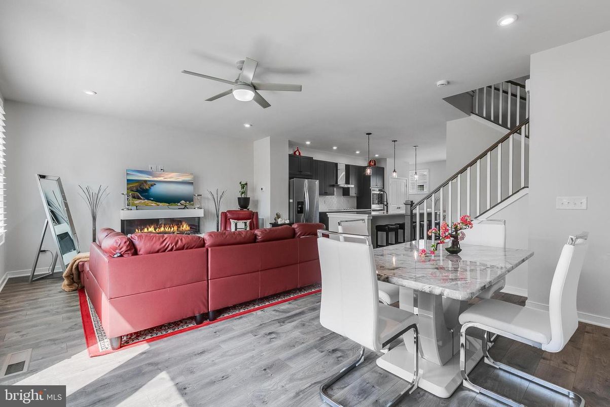 Dining room, Fireplace, Interior, Kitchen, Living room, Pendant Lights, Recessed Lighting, Stainless Steel Appliances, Wood Texture Flooring