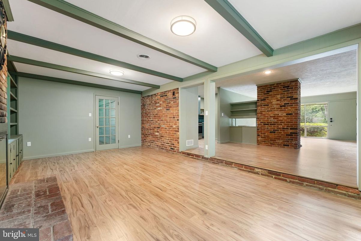 Empty room, Fireplace, Interior, Recessed Lighting, Stone Walls, Wood Texture Flooring