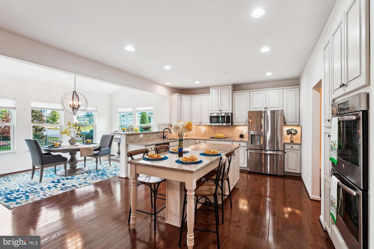 Chandelier, Dining room, Interior, Kitchen, Pendant Lights, Recessed Lighting, Stainless Steel Appliances, Wood Texture Flooring