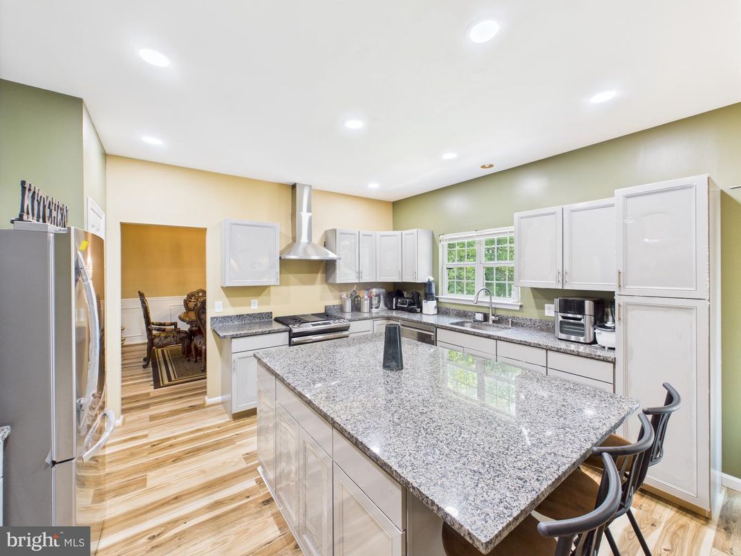 Dining room, Interior, Kitchen, Recessed Lighting, Stainless Steel Appliances, Wood Texture Flooring