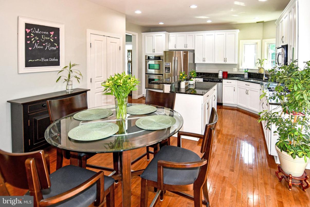 Dining room, Interior, Kitchen, Recessed Lighting, Stainless Steel Appliances, Wood Texture Flooring