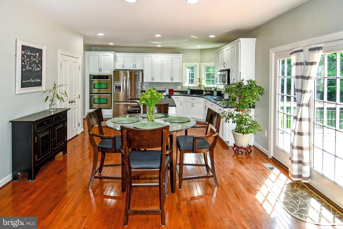 Dining room, Interior, Kitchen, Recessed Lighting, Stainless Steel Appliances, Wood Texture Flooring